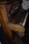 An interesting 19th Century mahogany pianette (73 keys) having fretwork back panel , and animalistic