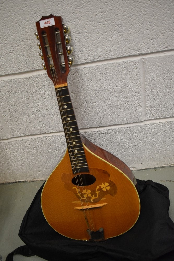 An Ozark for Stentor teardrop mandolin havung inlaid shamrock decoration around sound hole, in