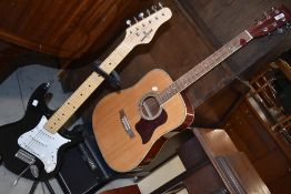 A Spider acoustic guitar, a Behringer electric guitar and practice amp