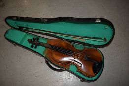 A traditional violin, bow stamped Artist, with hard case