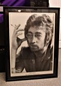 A large John Lennon framed poster measures 68 x 105