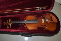 A modern violin, labelled Presta, in modern case with bow