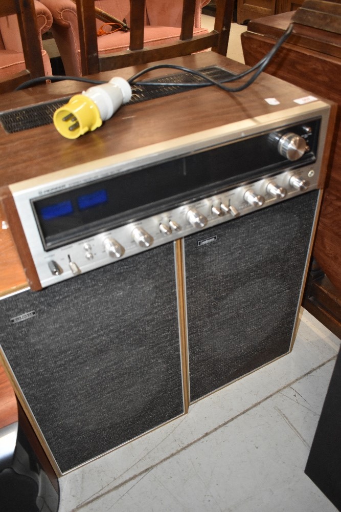 A vintage Pioneer stereo receiver, model SX-737 and a pair of Goodmans speakers