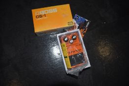 A Boss DS-1 distortion effects pedal, boxed, looks unused