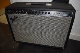 A Fender Ultimate Chorus guitar amplifier, type PR204, serial number CR-028902, with footswitch etc