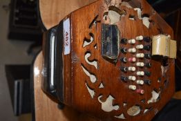 A traditional 48 button concertina, labelled Lachenal, on cloth interior , probaby late 19th/early