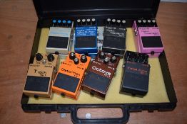Eight assorted Boss effects pedals comprising TW-1 auto wah, DD-3 digital delay, PS-2 pitch shifter,