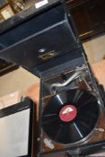 An early 20th Century HMV wind up gramophone and large selection of 78s
