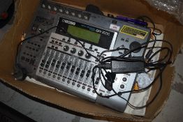 A Boss BR-1600 digital recording studio