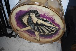 A vintage kick drum having painted dancing girl decoration
