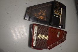Two traditional autoharps, being Mullers and Tokai