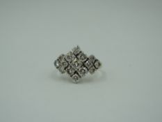 A diamond multi cluster dress ring, total approx 1ct in a stepped claw mount to moulded shoulders on