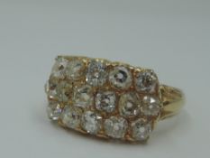 A three row diamond ring having sixteen old cut diamonds, approx 2ct total in a panel setting to
