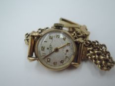 A lady's vintage 9ct gold Rolex wrist watch having Arabic numeral dial with subsidiary seconds in