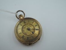 A yellow metal small top wound pocket watch having Roman Numeral dial to engraved face in engraved