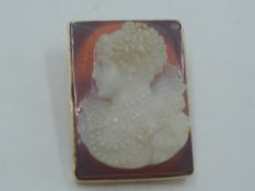 A glass cameo brooch of rectangular form depicting an Elizabethan lady in a yellow metal collared
