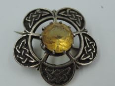 A Scottish silver IONA brooch by John Hart of Celtic design having central Citrine style stone,