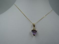 A 9ct gold pendant having amethyst and cubic zirconia decoration on a yellow metal chain stamped