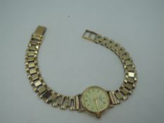 A 9ct gold wrist watch by Rotary having a baton numeral dial to champagne face in gold case with