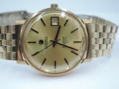 A gent's 1970's 9ct gold automatic wrist watch by Roamer, model Limelight 23, having baton numeral