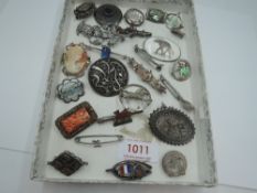 A selection of HM silver and white metal brooches, most stamped silver including souvenir, butterfly
