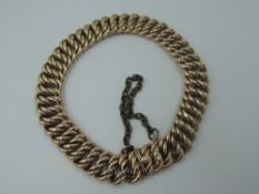 A rose metal double link bracelet having concealed clasp, bearing marks, probably Austrian, approx
