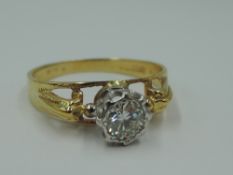 A diamond solitaire dress ring, approx 0.45ct in a collared coronet mount to open moulded shoulder