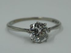 A diamond solitaire ring, approx 1ct in a claw set mount on a white metal loop stamped Plat &