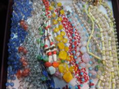 A selection of vintage bead necklaces including gold wire, woven, etc