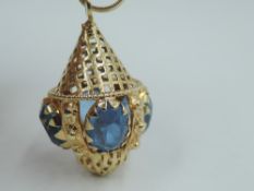 A yellow metal pendant stamped 750 in the form of a Moroccan/Libyan lantern having blue glass