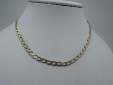 A 9ct gold flat curb chain of open form, approx 22' & 12.5g
