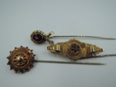 Two yellow metal stick pins and a brooch stamped 9ct, approx 7.6g