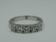 A five stone diamond half eternity ring, total approx 0.53ct in claw set mounts on platinum loop,