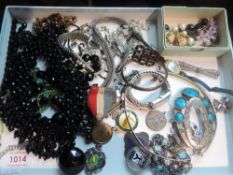 A selection of costume jewellery including beads, brooches, rosary beads, watches etc