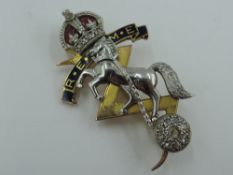 A cased 9ct gold, platinum and enamel brooch regarding the Royal Electrical and Mechanical Engineers