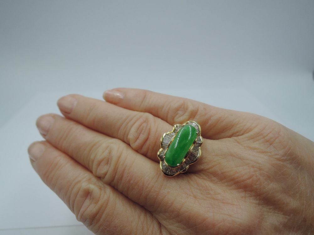 A jadeite cabouchon dress ring, approx 2.8ct within a baguette diamond set ballerina frilled - Image 2 of 5