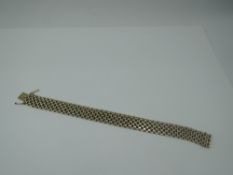 A yellow metal articulated brick effect bracelet stamped 585 having concealed clasp, approx 34.7g
