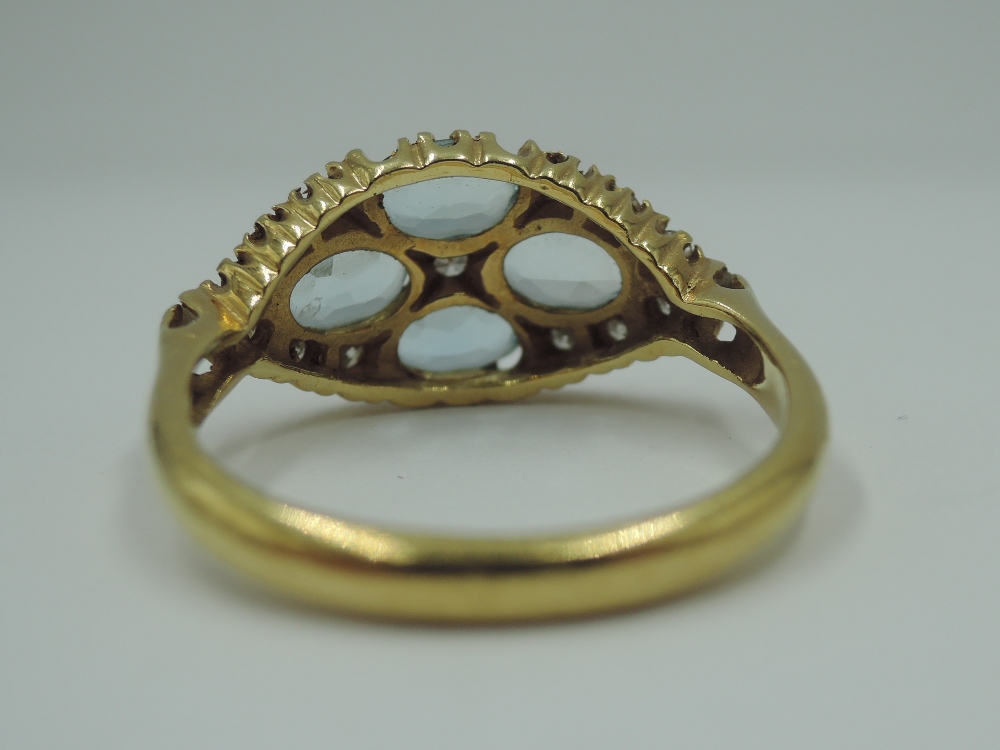 An aqua marine dress ring having four oval stones in a lozenge shaped panel with diamond chip - Image 4 of 4