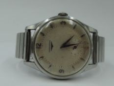 A gent's 1950's wrist watch by Longines having Arabic and numeral dial with subsidiary seconds in