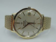 A gent's gold plated Omega Constellation automatic chronometer wrist watch having baton numeral dial