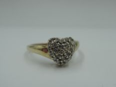 A diamond heart cluster ring , approx 0.25ct to moulded shoulders on a 9ct gold loop, size P &