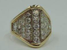 A diamond dress ring having approx 2ct of diamonds in an oversized pave set ridged mount on a yellow