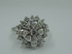 A diamond fancy daisy cluster dress ring set with marquise cut and brilliant cut diamonds, total
