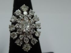 A large old cut twenty seven diamond cluster ring of open marquise shaped form, total approx 3.2ct