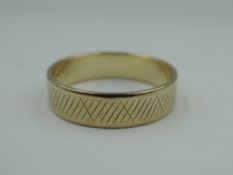 A 9ct gold wedding band having engraved decoration, size M & approx 2.4g