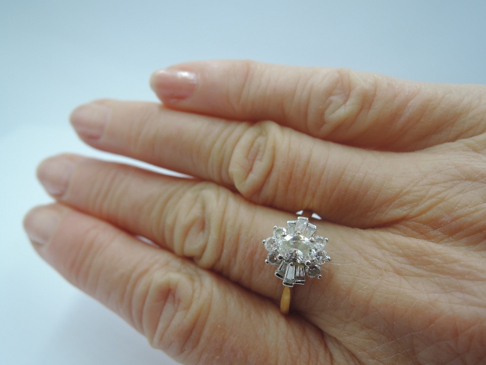 A lady's dress ring having a diamond cluster with central oval diamond surrounded by baguette and - Image 2 of 2