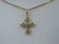 A yellow metal cubic zirconia set cross on a 20' 9ct gold curb chain, approx 2.7g