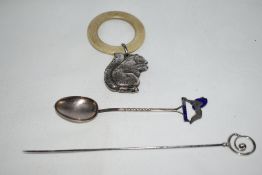 Three pieces of silver by Charles Horner including a baby's rattle modelled as a squirrel with