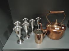 A set of six metal cast goblets a heavy copper measuring cup and a stove kettle