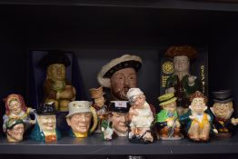 A selection of character mugs and tankards including Burleigh ware and Staffordshire